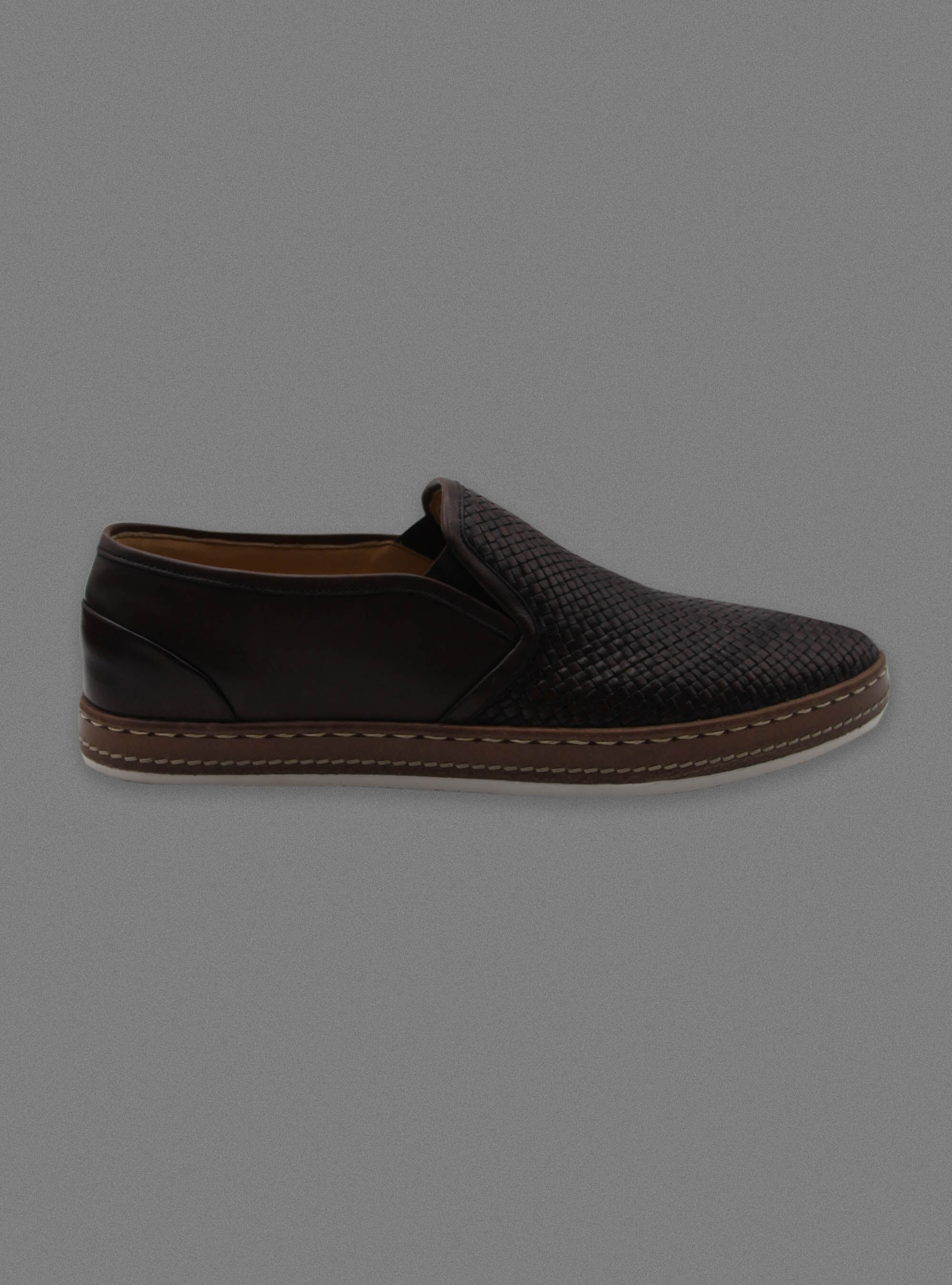 Scarpe slip on in pelle intrecciata