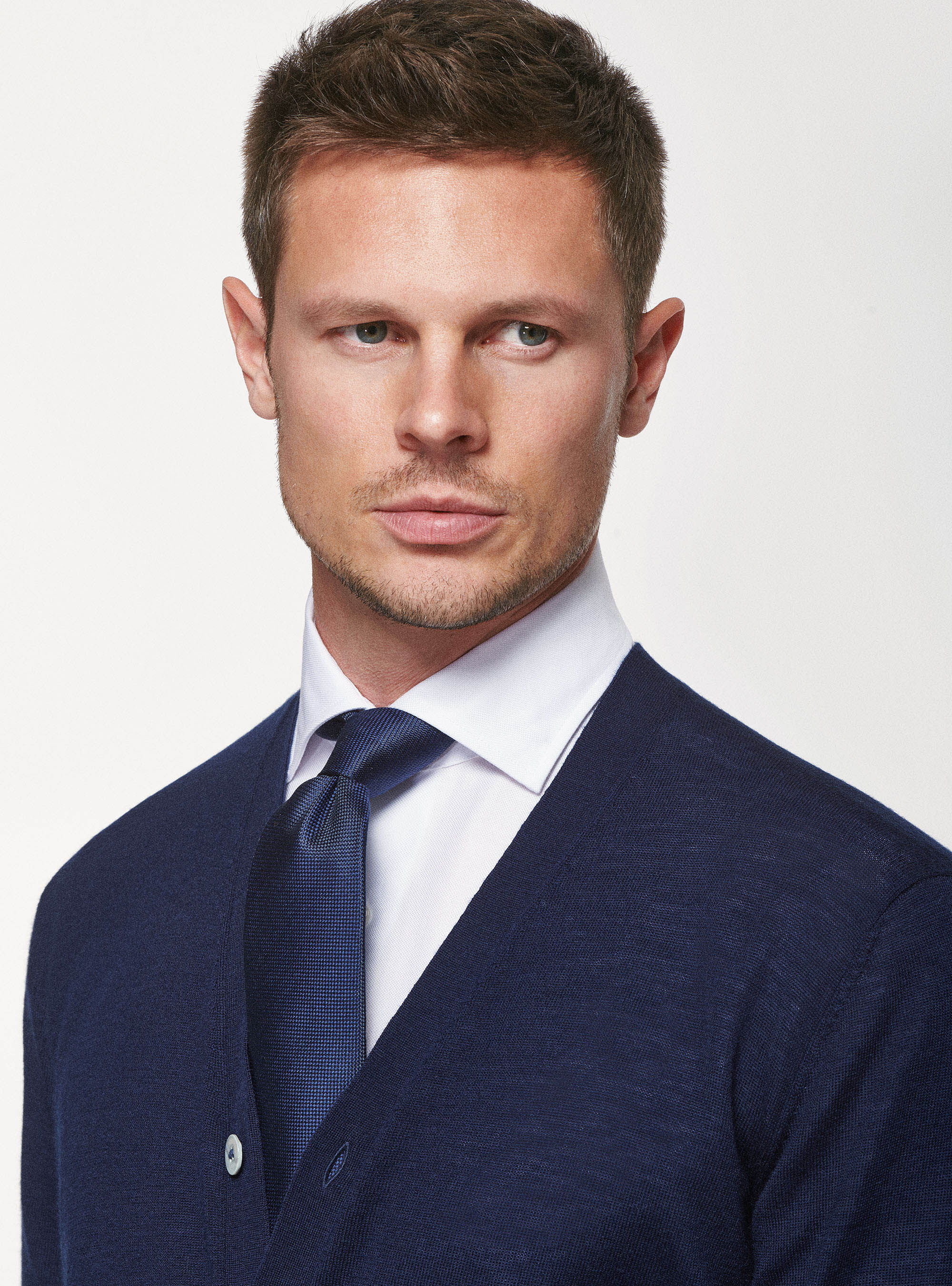 Suit with cardigan under top