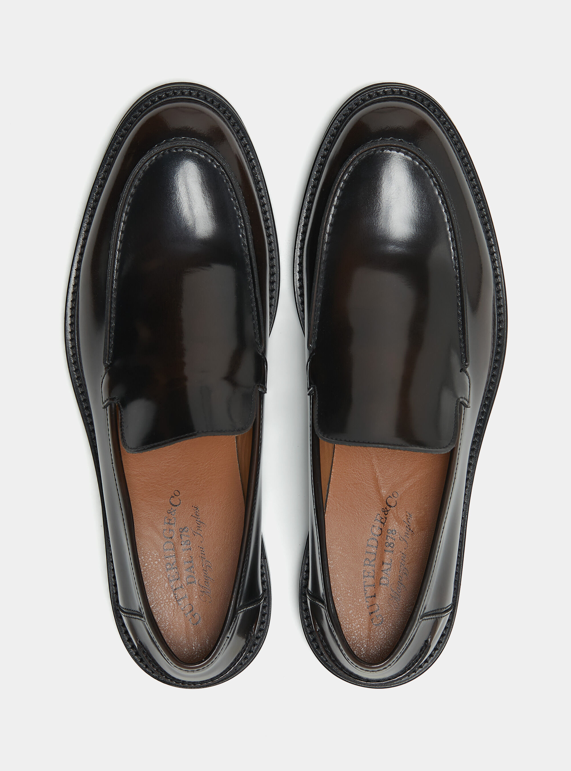 Attaching soles to moccasins top