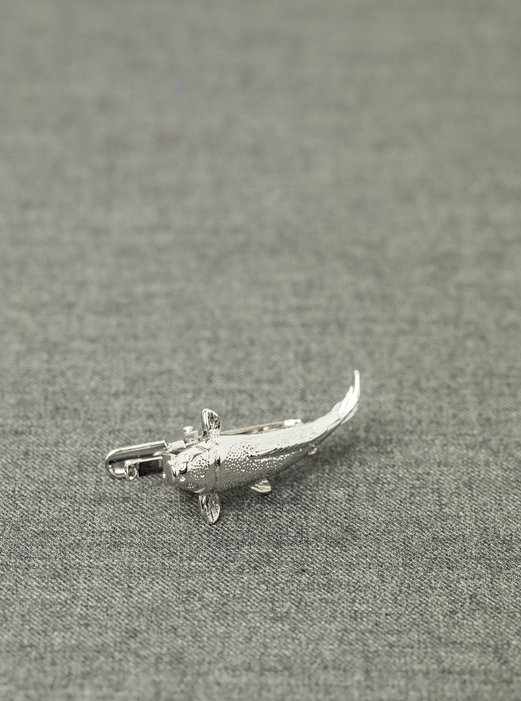 Fermacravatta carpa, UNICO